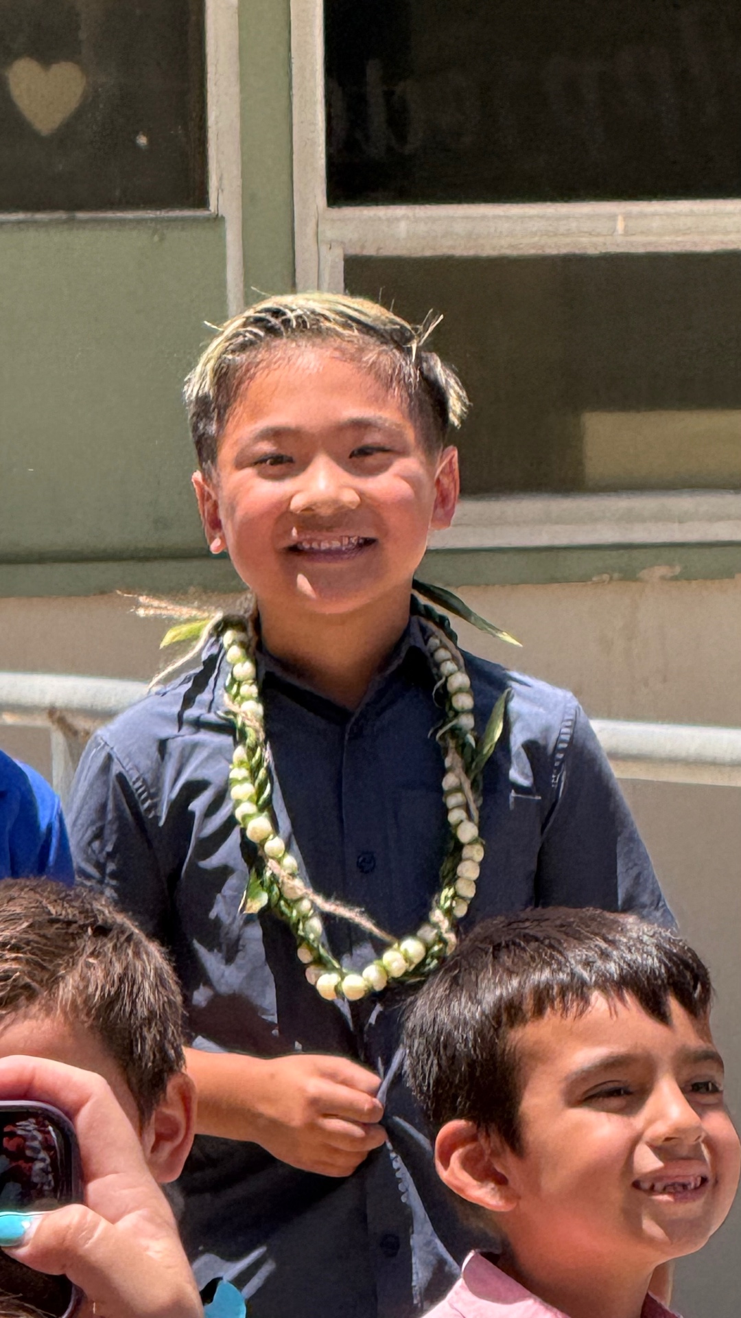 Sullivan smiling with his lei